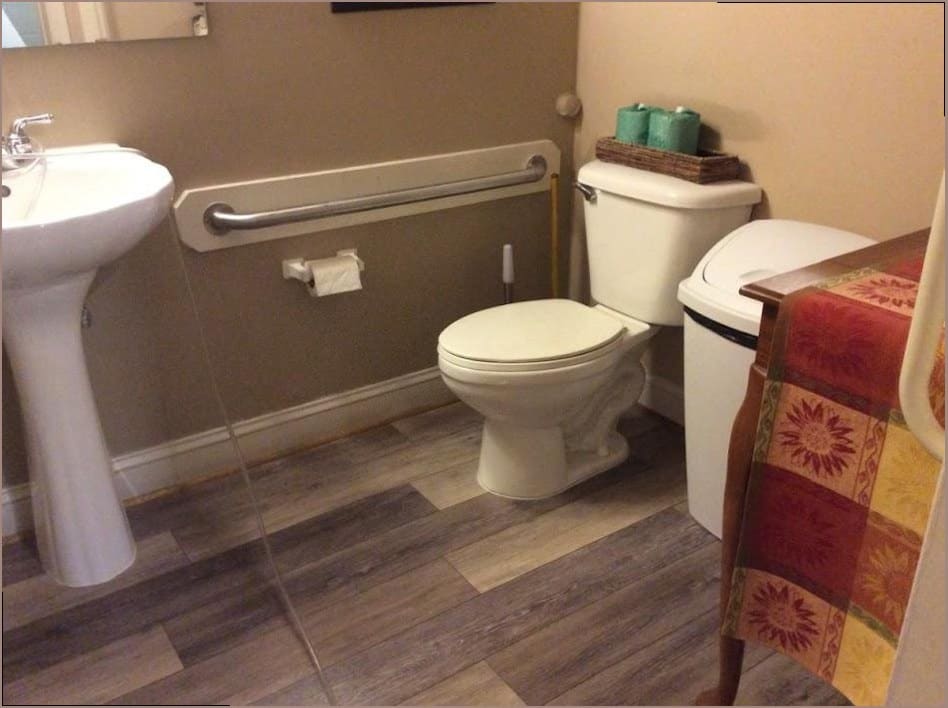 Accessible bathroom remodel with grab bar and comfort-height toilet, the kind of full-home plumbing work done in Wrightstown farmhouses
