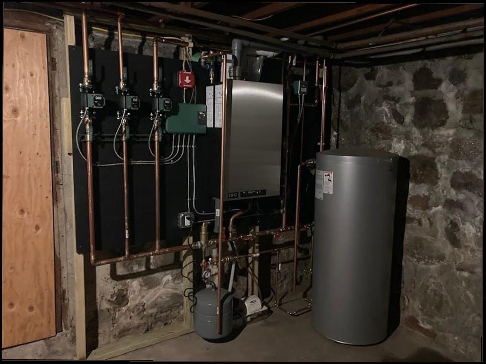 Boiler, indirect water heater, and circulator pumps installed by Duncan Family Plumbing in a Bucks County home