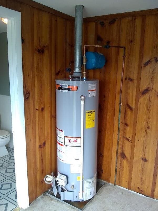 Gas water heater with expansion tank installed by Duncan Family Plumbing in a Bucks County home