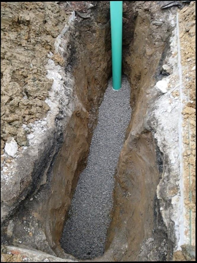 Sewer line excavation with gravel bed and SDR pipe by Duncan Family Plumbing